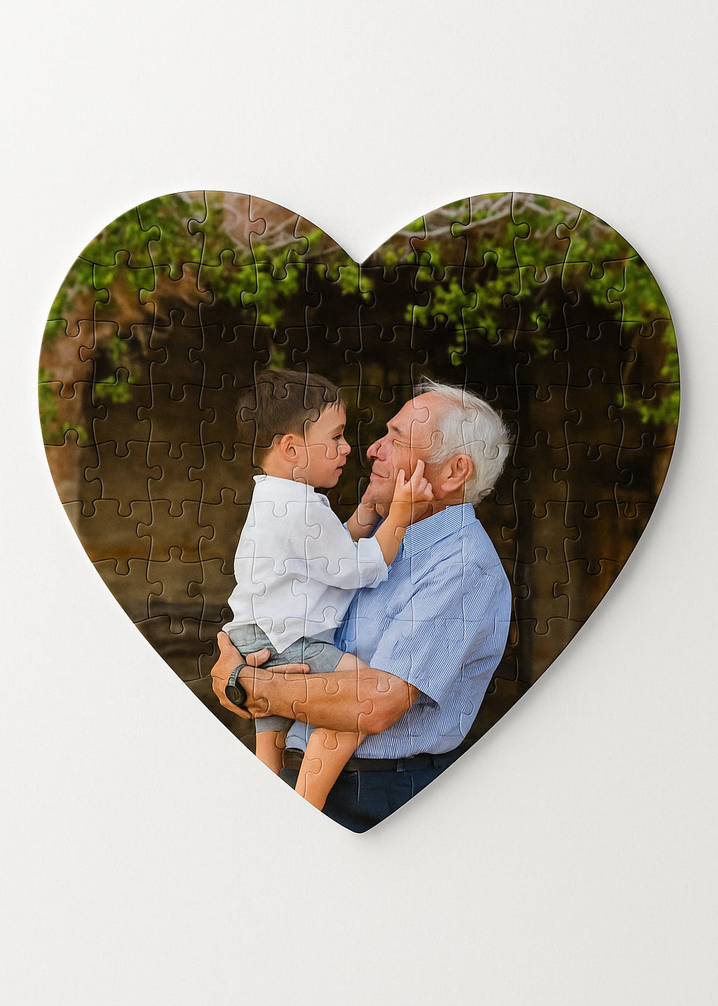 A personalized puzzle with a photo of a grandfather and his grandson hugging in a garden.